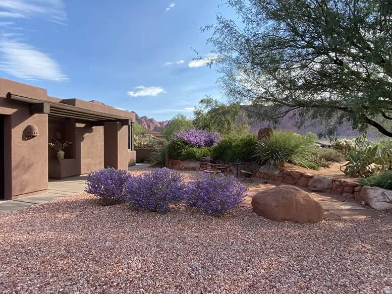 Front of Property View with Beautiful Mature Landscaping