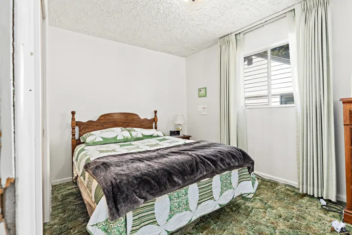 Primary bedroom and a window with blinds