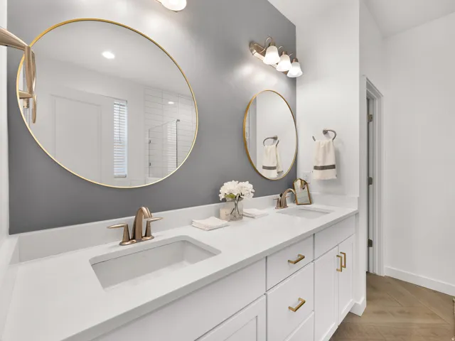 Dual vanity with integrated sinks and white countertops