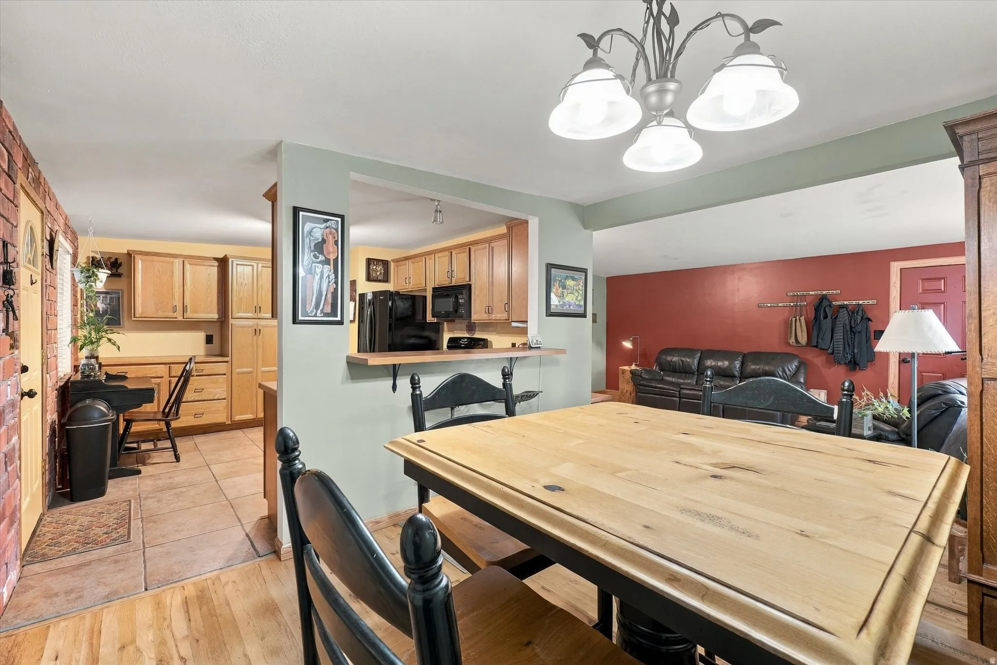 Open-concept living area with wood-finish flooring