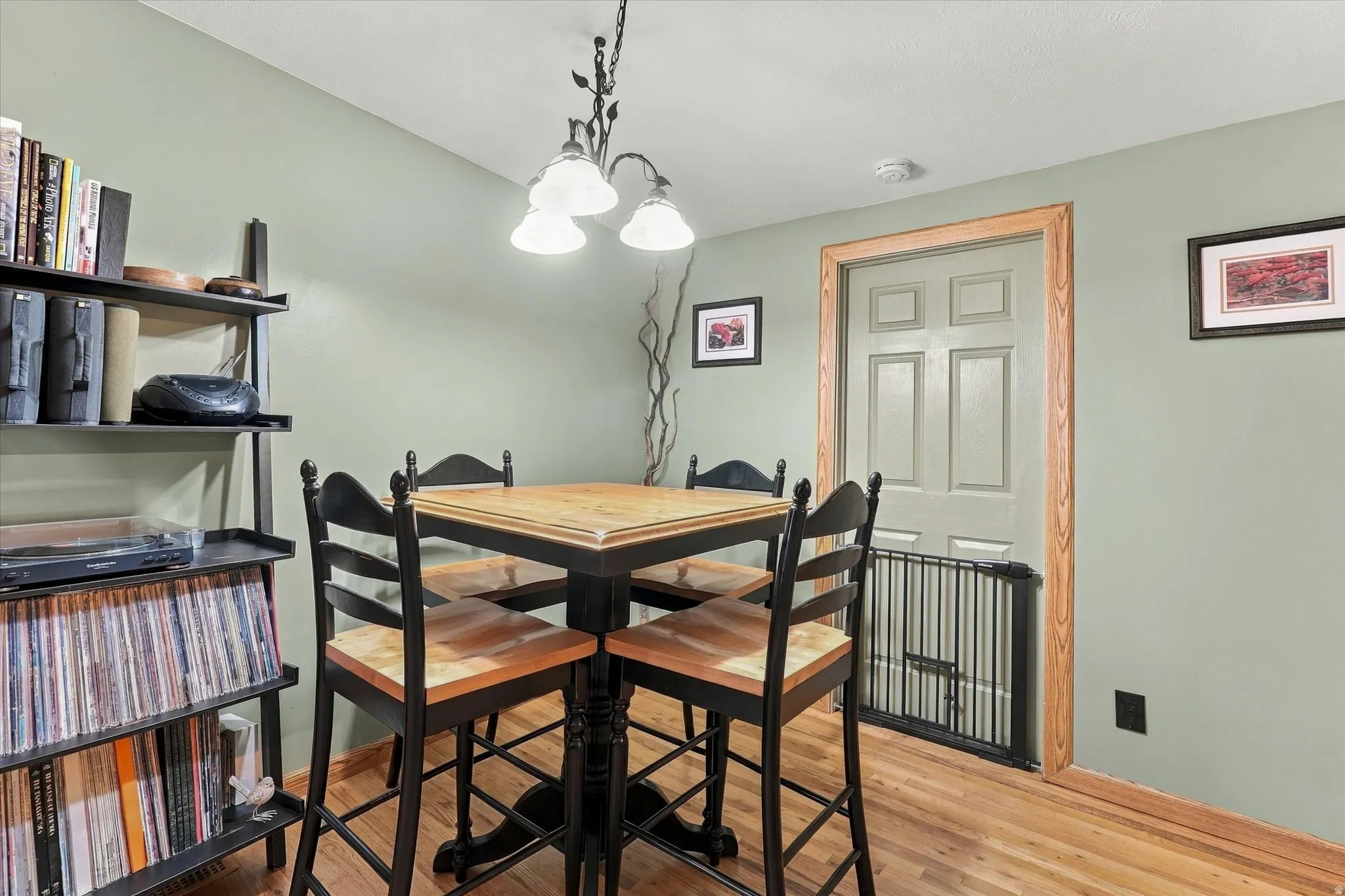 Wood-finish flooring with light green wall tones