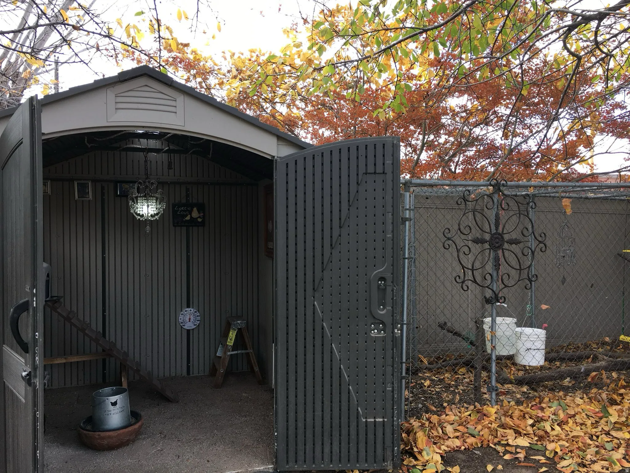 Chicken coop/storage shed with interior light fixture