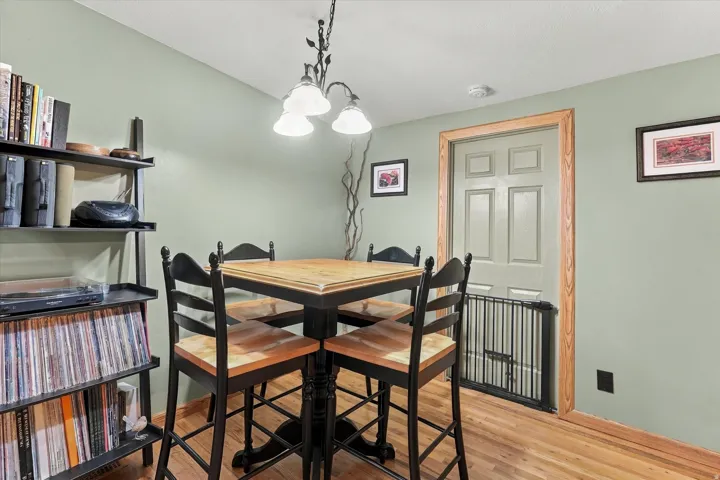 Wood-finish flooring with light green wall tones