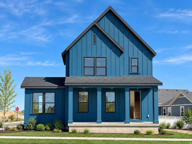 Blue vertical siding exterior with a contrasting dark roof