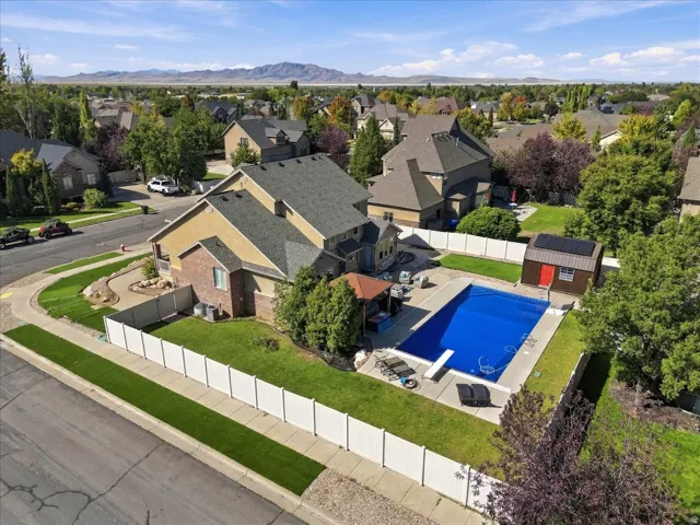 In-ground swimming pool with surrounding concrete patio