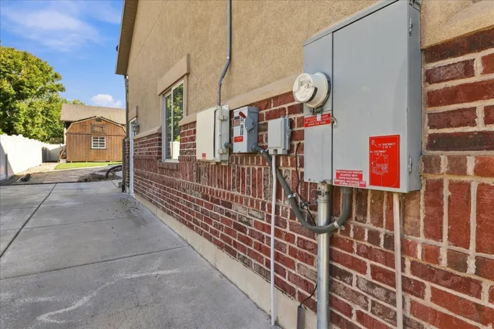 Brick and stucco exterior with a concrete pathway