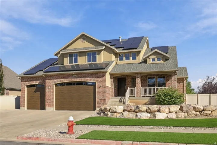 Brick and stucco exterior with multiple gables