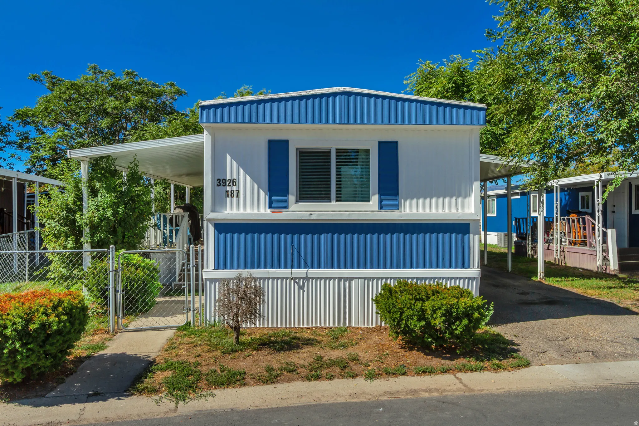 White and blue exterior with horizontal siding panels