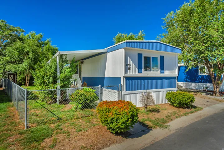 White and blue exterior with vertical siding