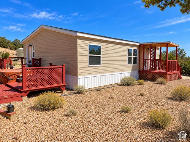 Beige horizontal siding with white trim