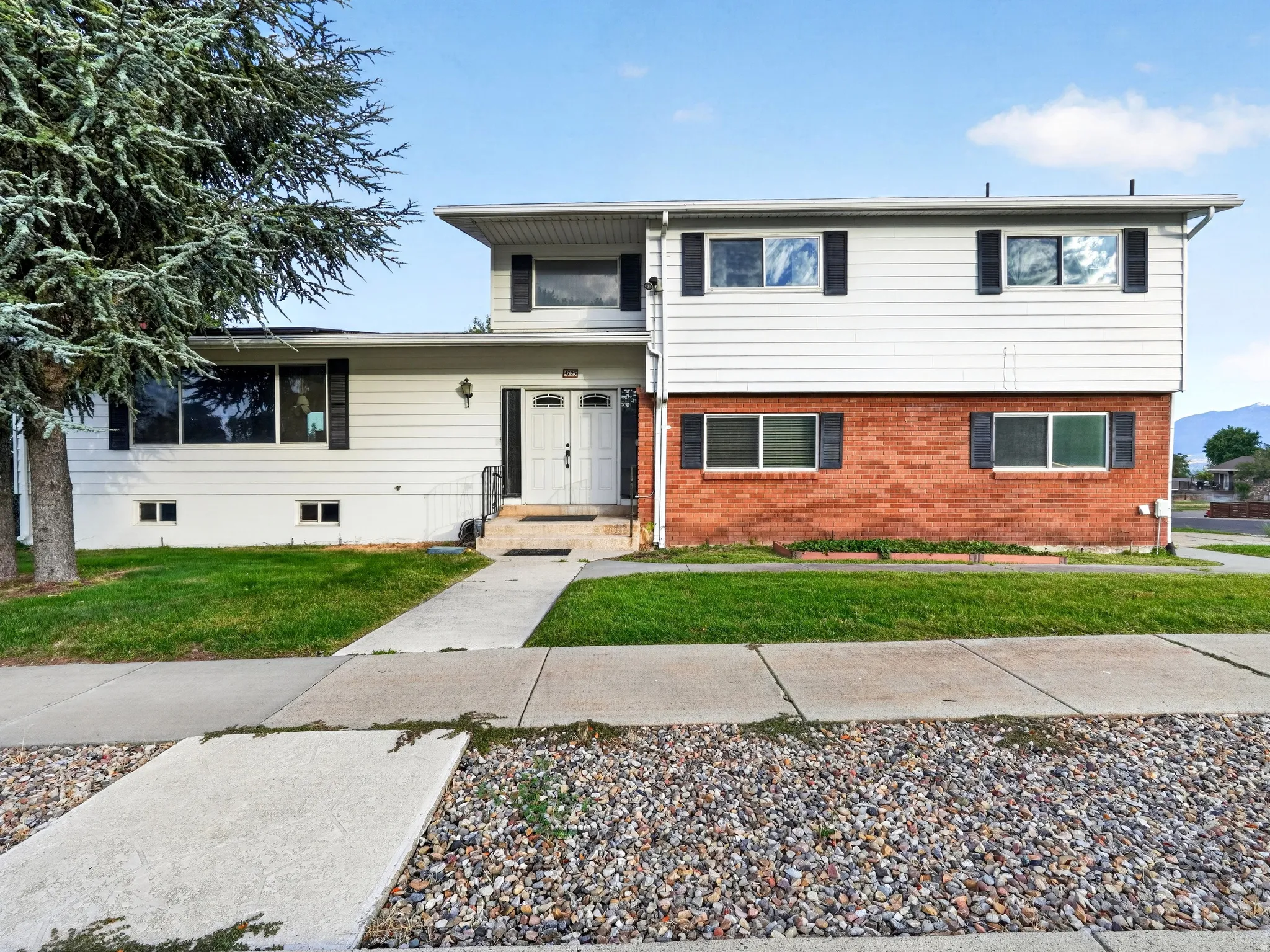 Two-story exterior with brick and horizontal siding