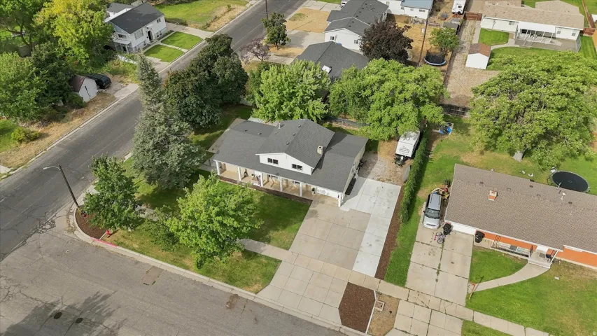 Two-story residence with a covered porch, an attached garage, and a concrete driveway