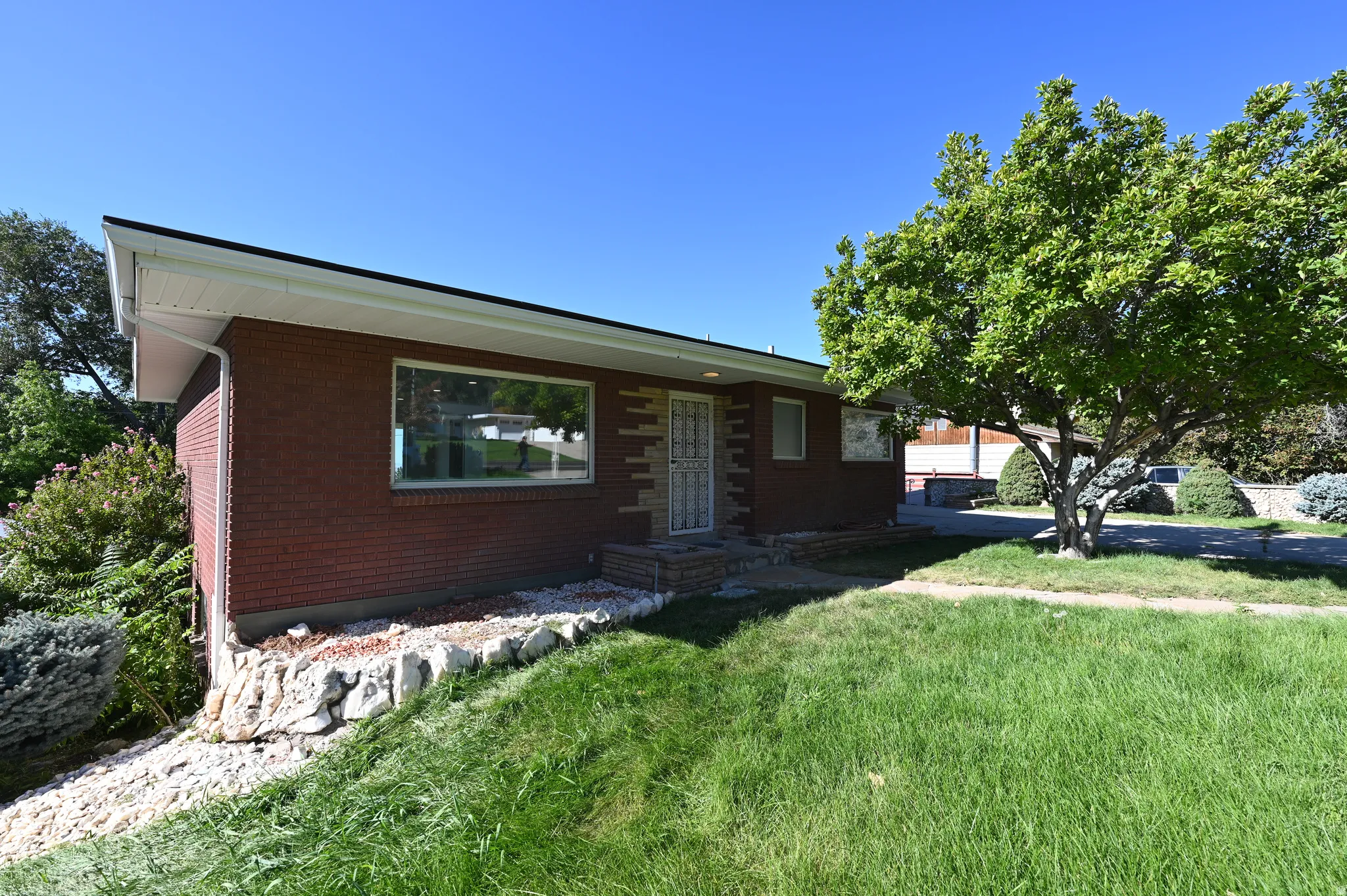 Brick facade with a white soffit and gutter system