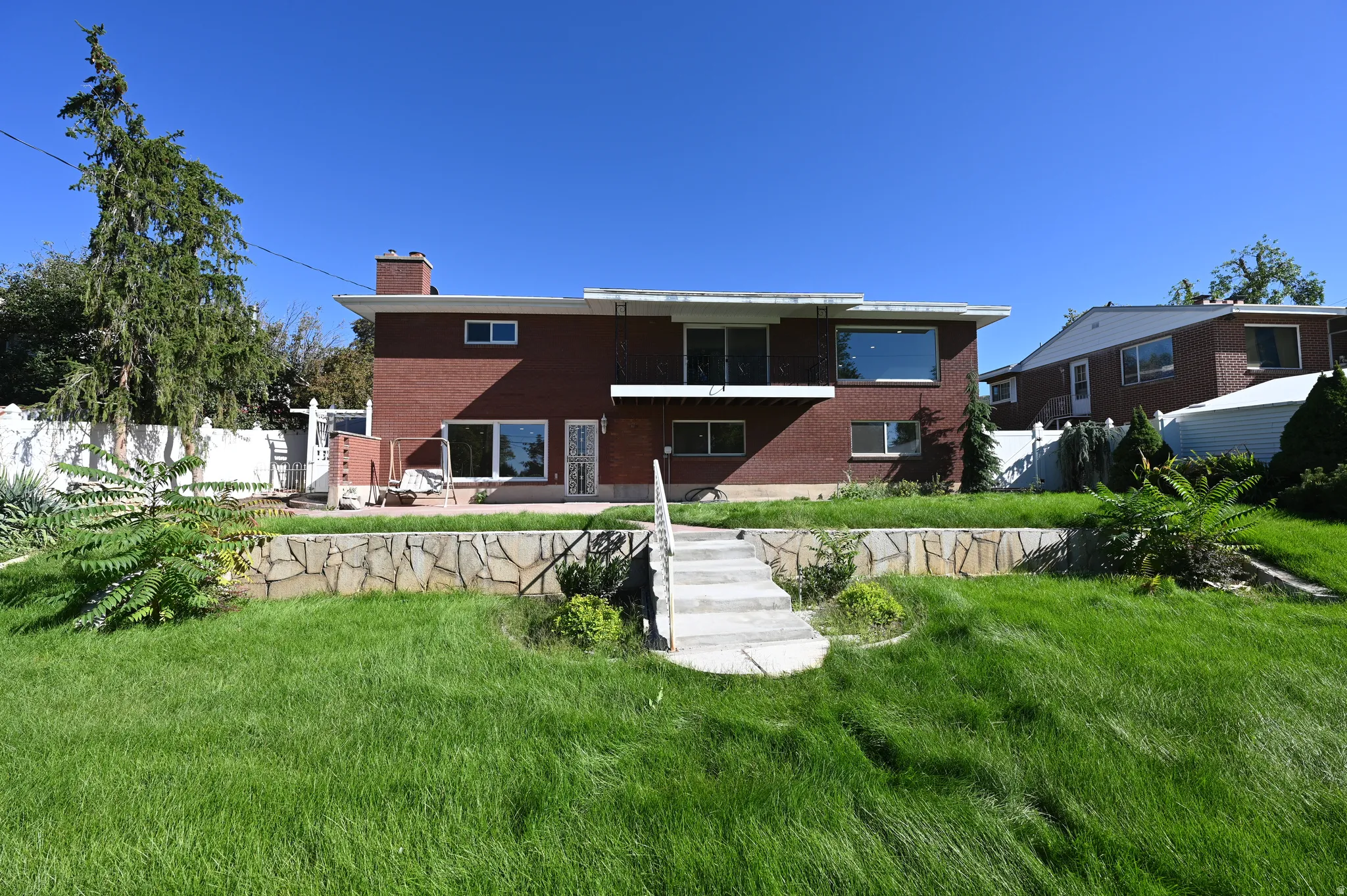 Brick exterior with a second-story balcony