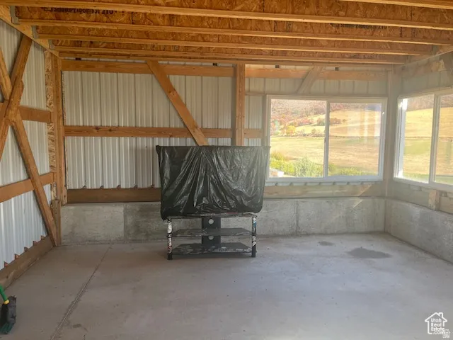 Exposed wood beam construction with metal panel walls
