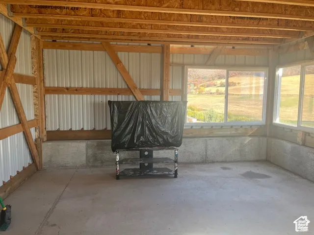 Exposed wood beam construction with metal panel walls