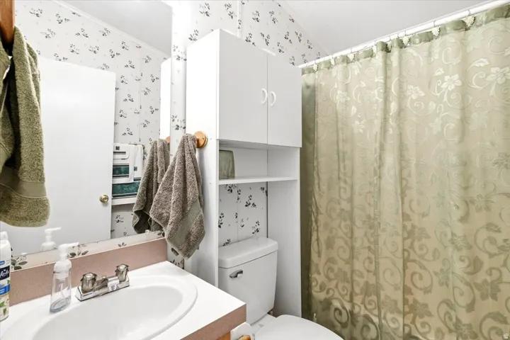 White vanity with an integrated sink and chrome faucet