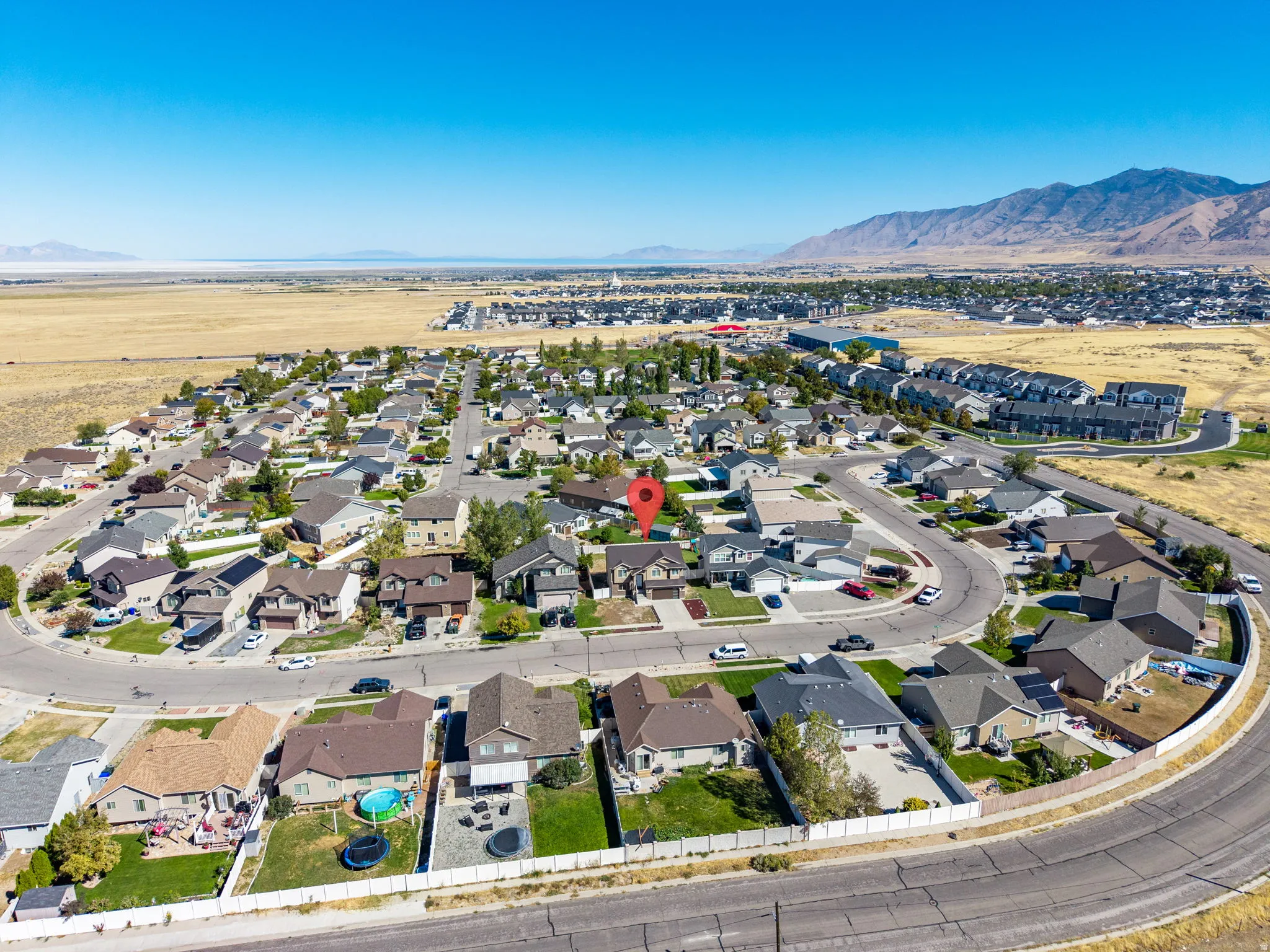 Residential neighborhood setting with mountain backdrop