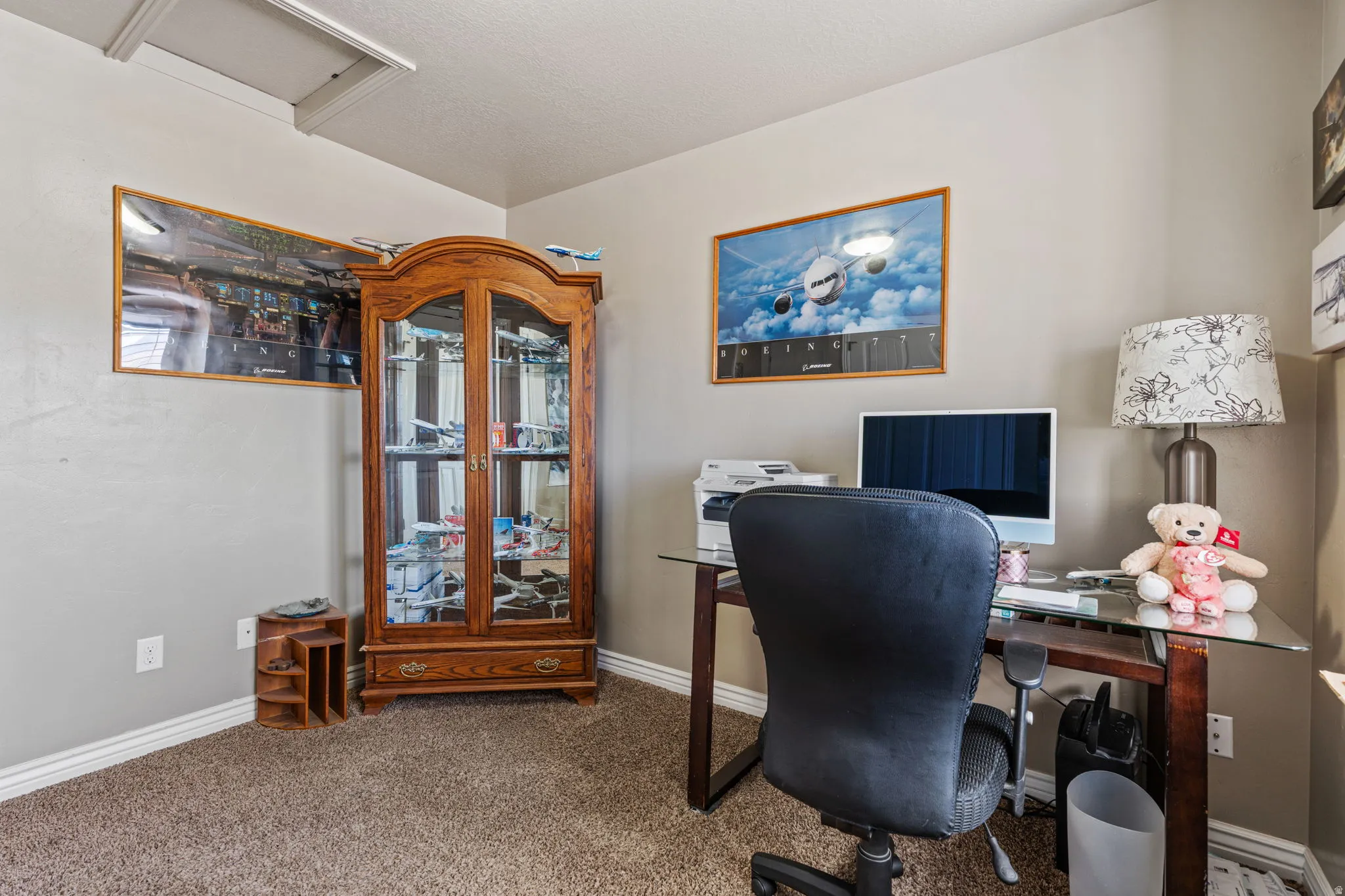 Neutral wall paint throughout, textured carpet flooring, and white trim