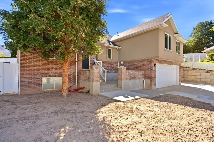 Brick and stucco exterior with white trim