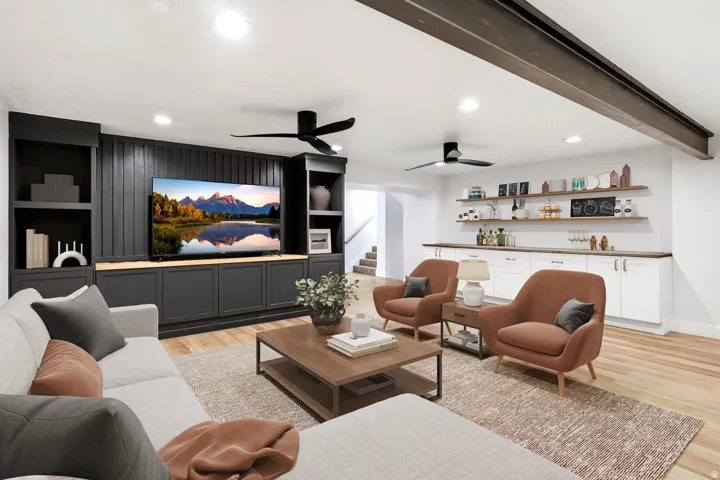 Built-in media center with vertical paneling, integrated shelving, and lower cabinetry