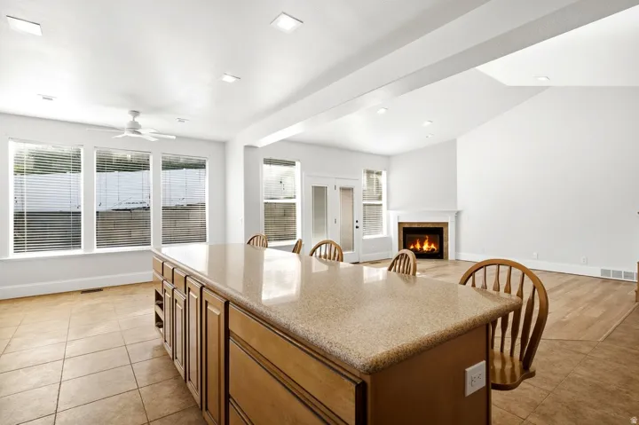 Spacious kitchen island with a light-colored countertop and wood-finish cabinetry
