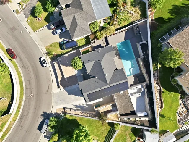 Private backyard oasis featuring a swimming pool, spacious patio area, and mature landscaping