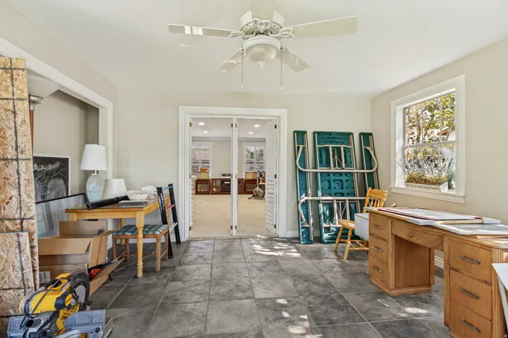Recessed lighting, ceiling fan, tile flooring, interior French doors, and ample natural light