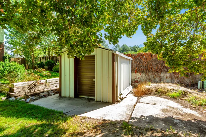 Metal storage shed with concrete pad