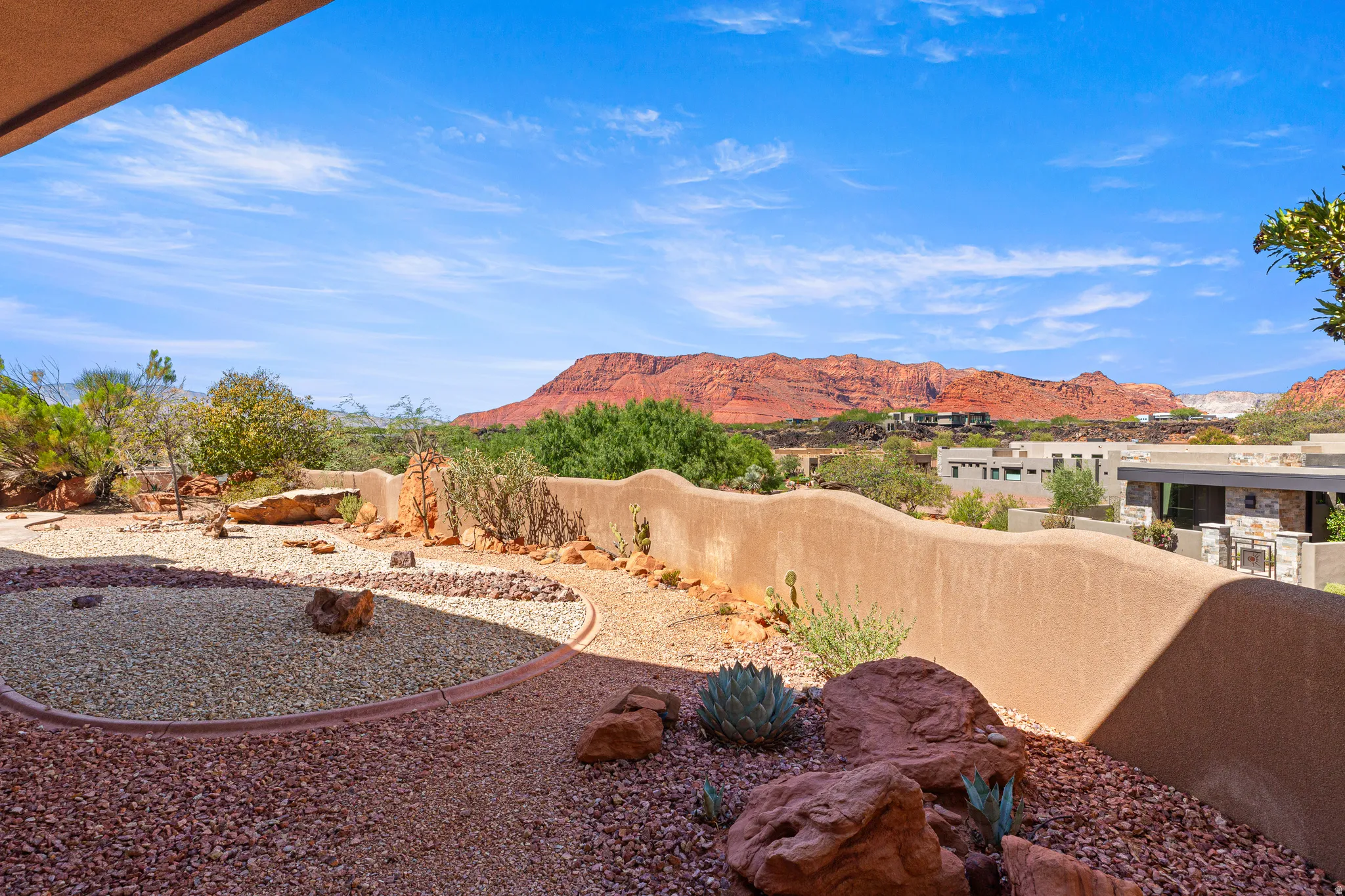 Exterior courtyard with gravel landscaping and desert plantings