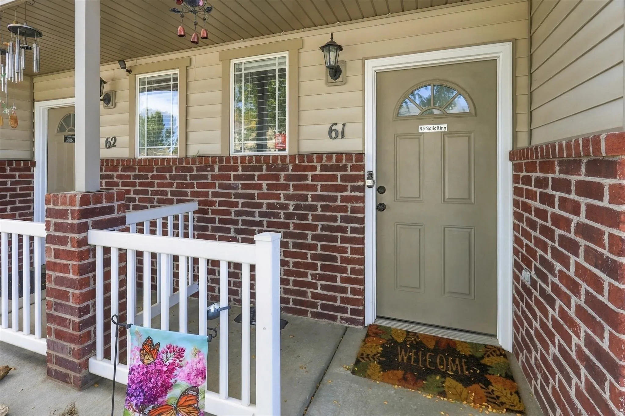 Brick facade with tan siding