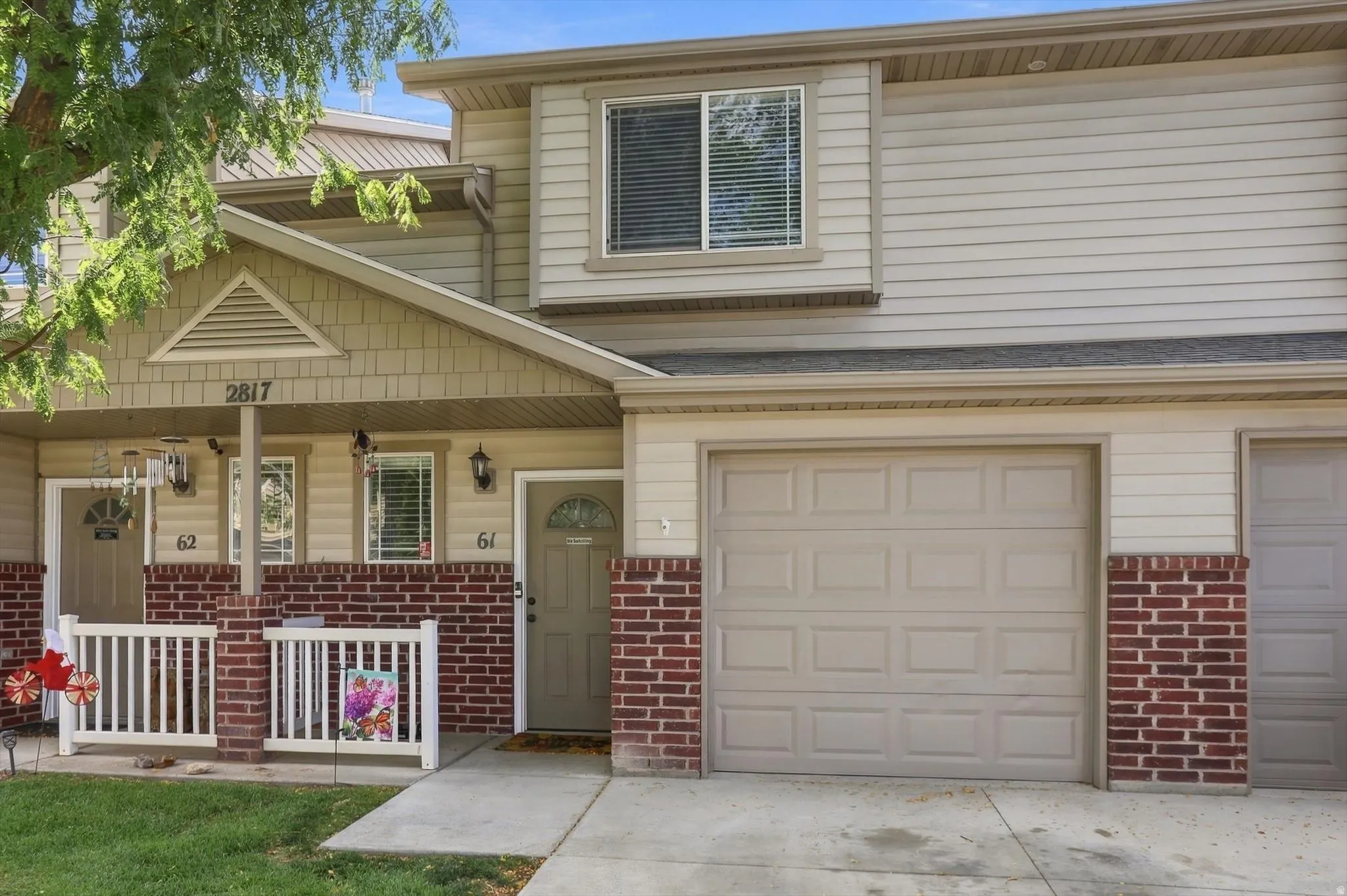 Two-story exterior with horizontal siding and brick accents