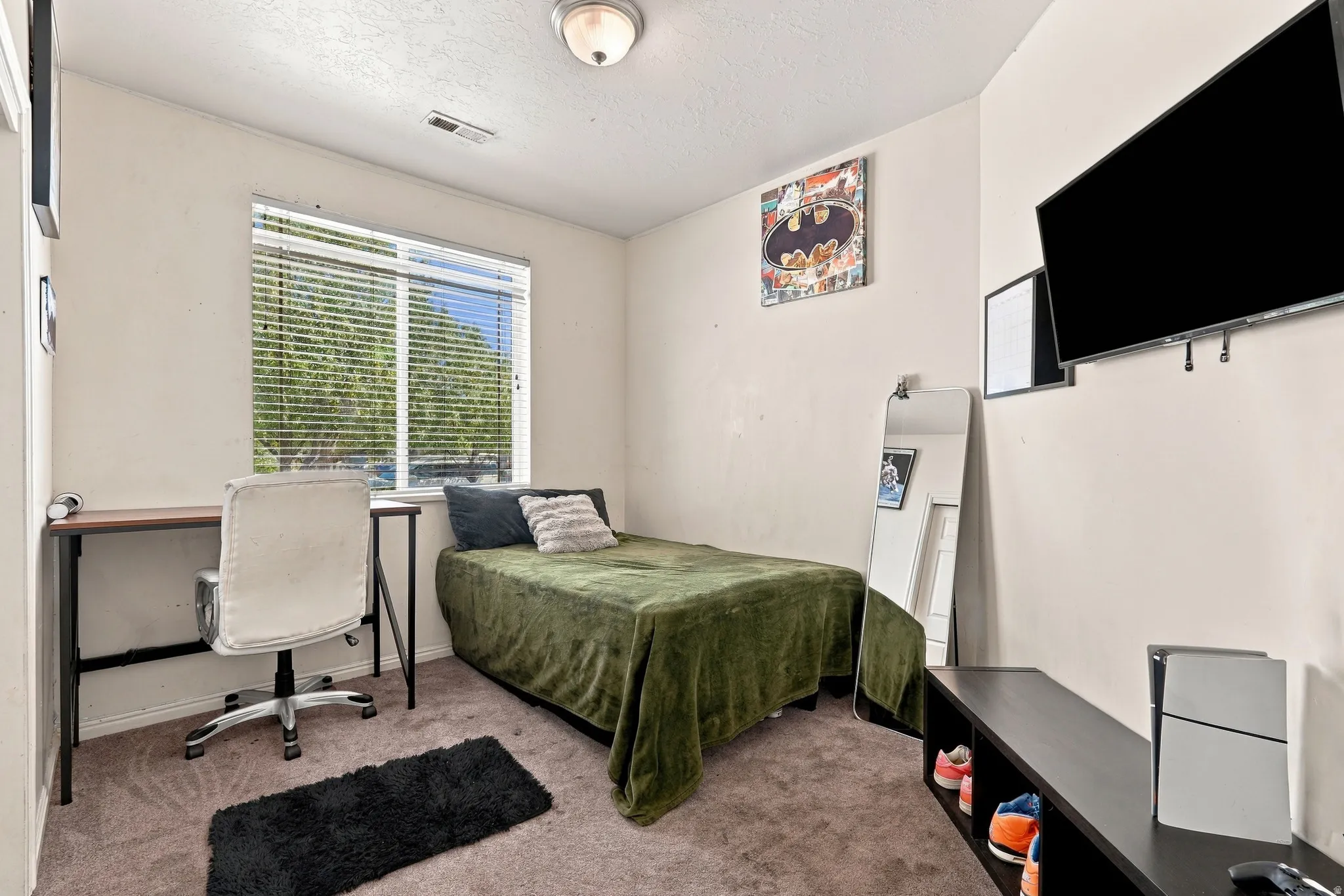 Window with horizontal blinds, neutral wall paint, and ceiling-mounted light fixture