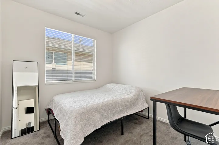 Neutral wall paint and carpeted flooring