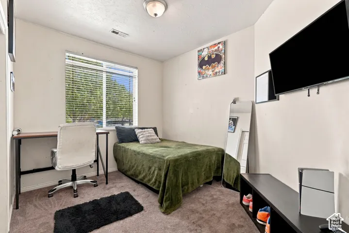 Window with horizontal blinds, neutral wall paint, and ceiling-mounted light fixture