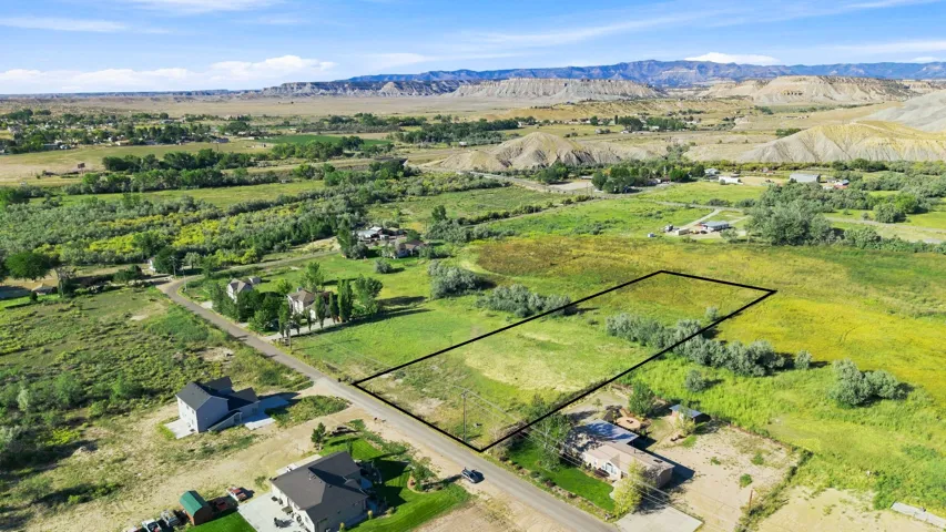 Expansive undeveloped land parcel with surrounding established properties