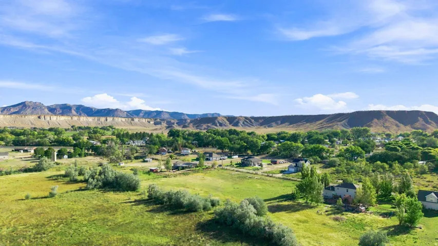 Expansive rural landscape with distant mountain formations