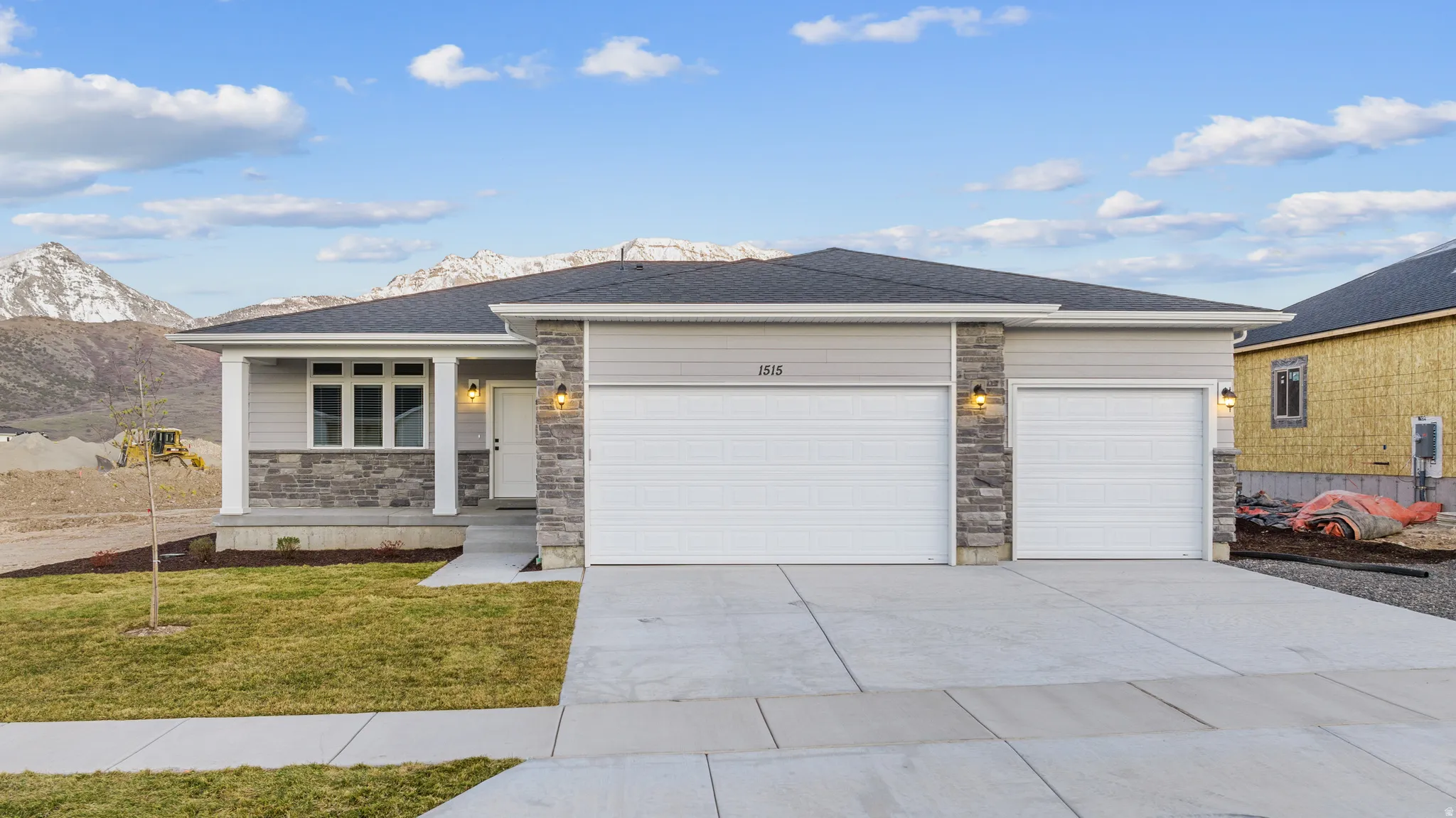 Gray siding exterior with stone accents