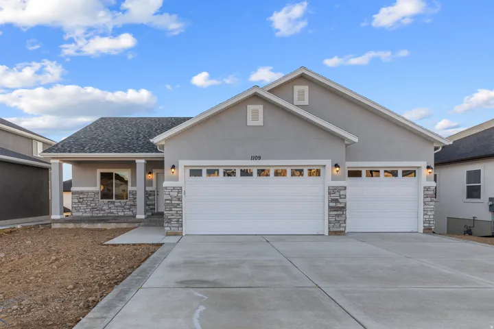 Contemporary exterior with stucco siding and stone accents