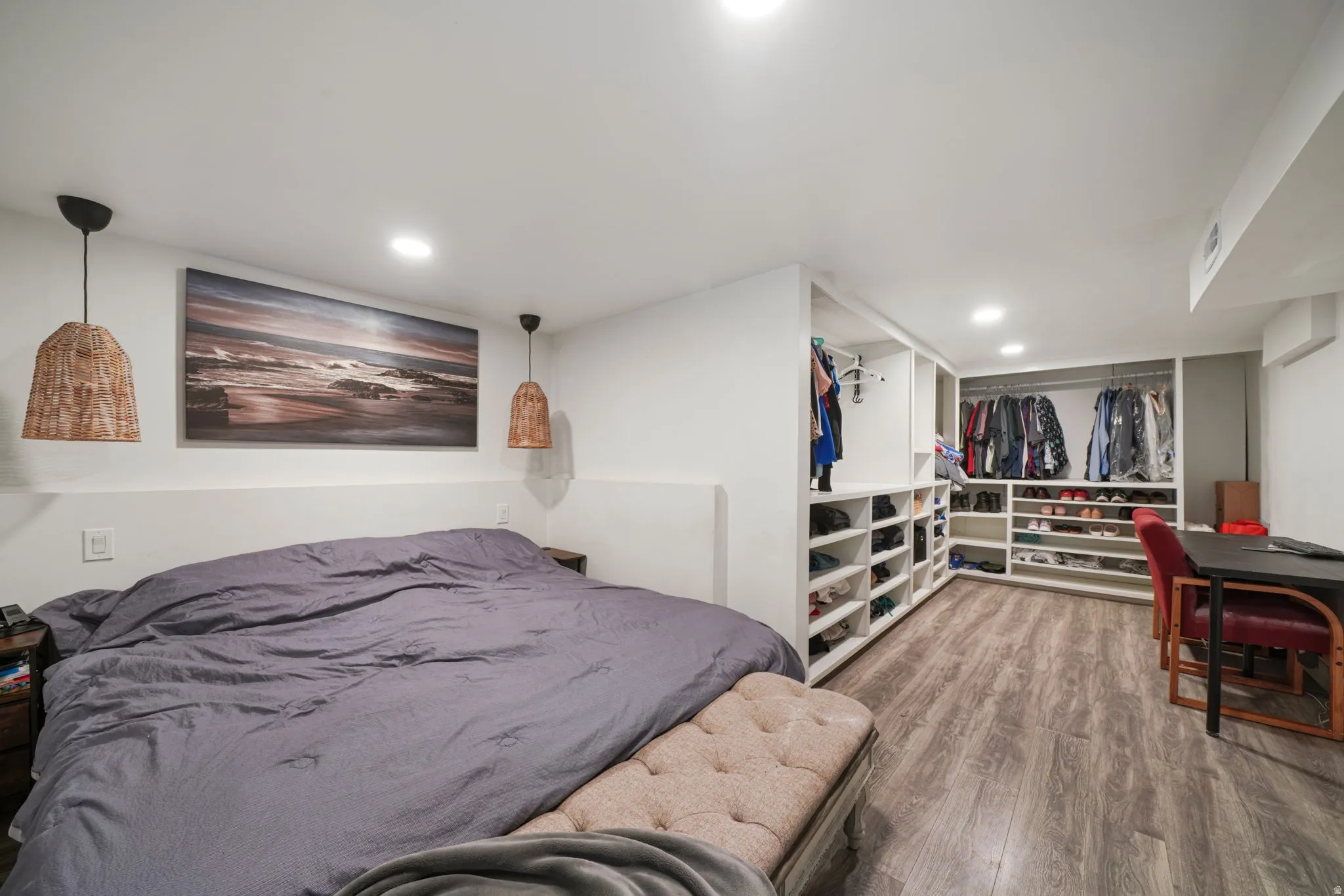 Recessed ceiling lighting, wood-look flooring, and built-in closet organization system
