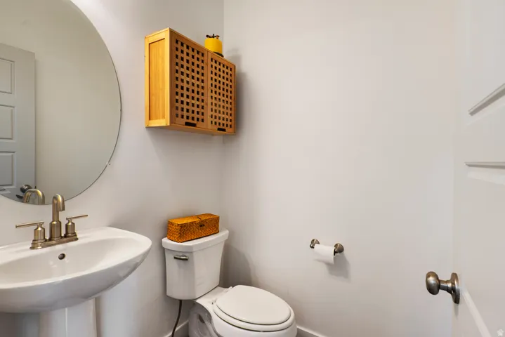 Pedestal sink with brass-finish faucet