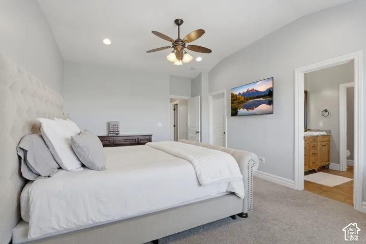 Vaulted ceilings with recessed lighting, ceiling fan with integrated light fixture, and carpeted flooring