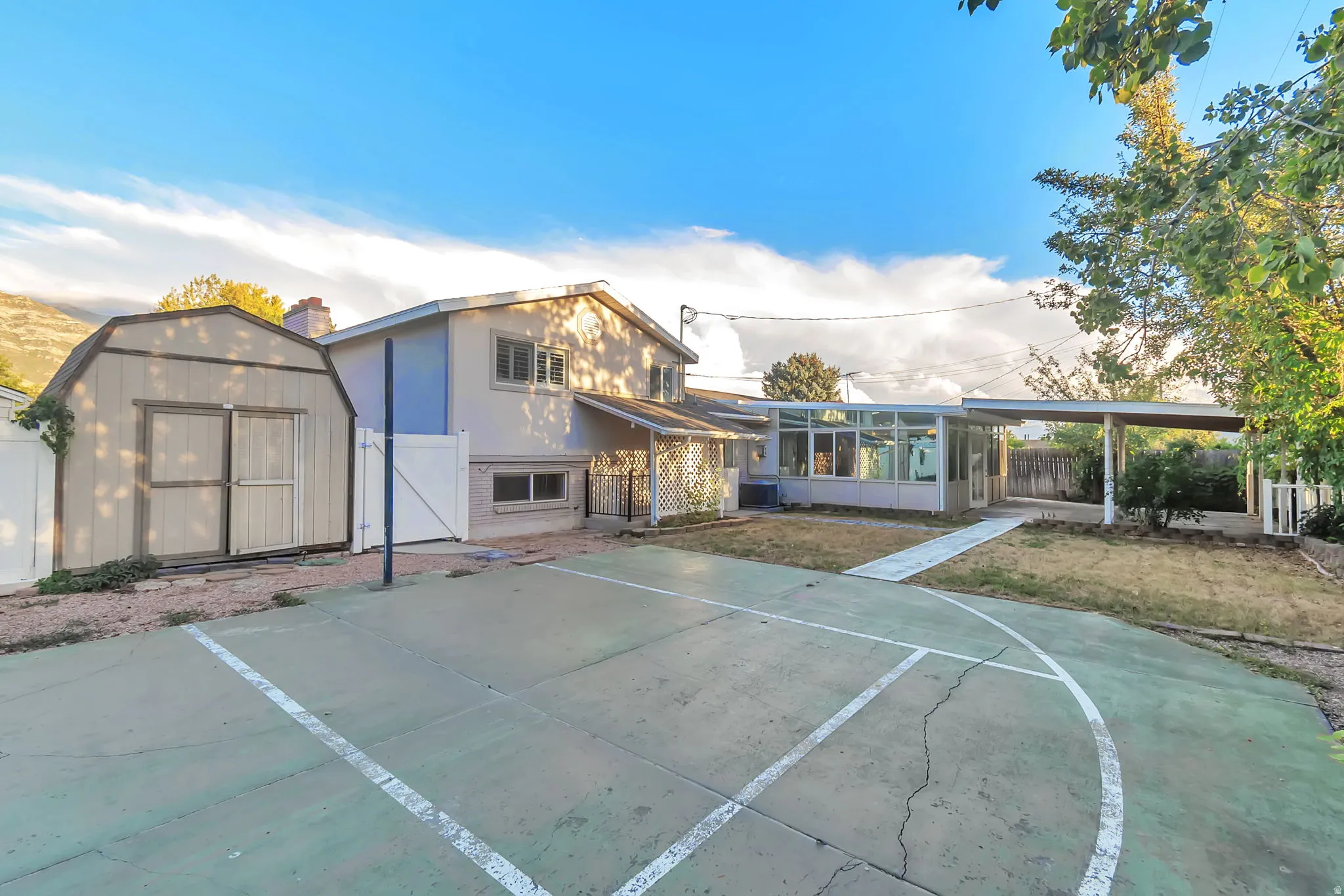 Concrete sport court, dedicated storage shed, covered patio