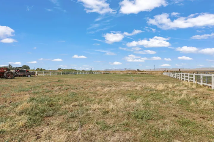 Expansive open land with perimeter fencing