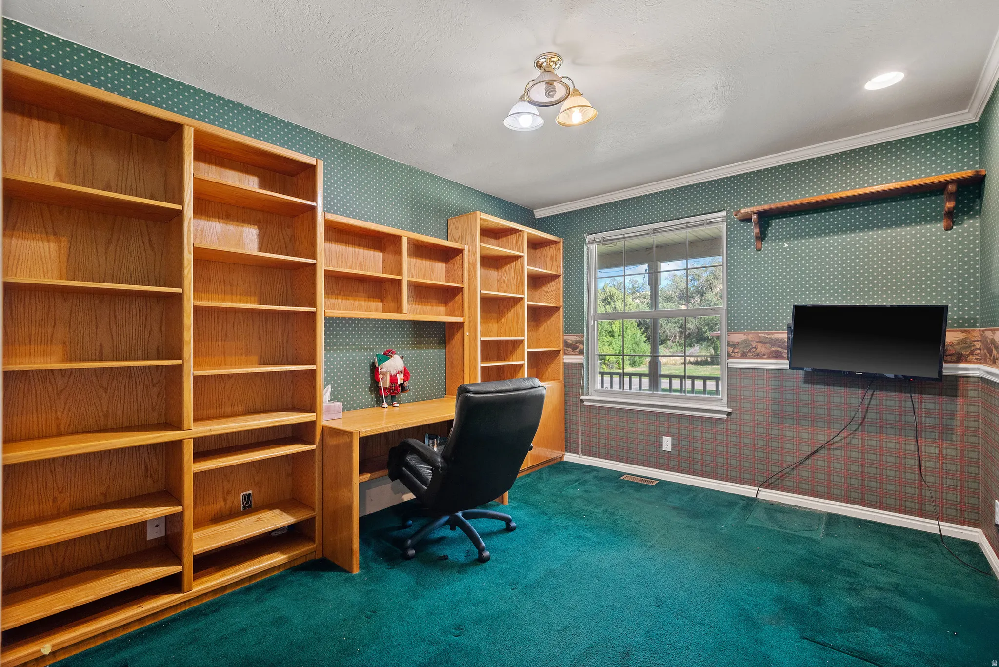 Built-in wood-finish shelving and desk unit