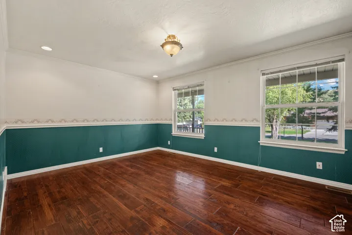 Rich wood-finish flooring complemented by a two-tone wall treatment