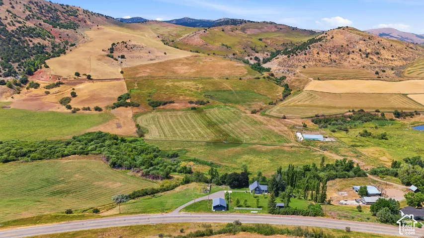 Expansive natural landscape with rolling hills and cultivated fields