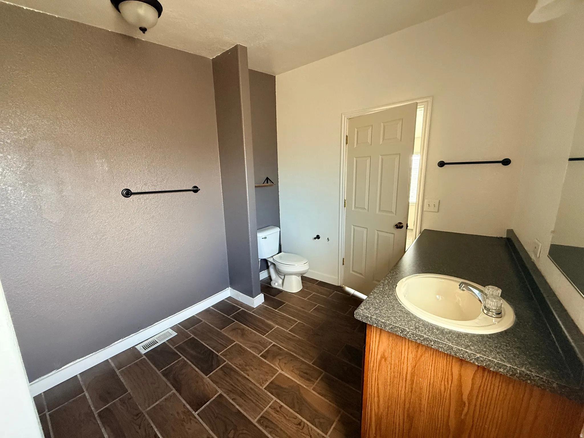 Wood-finish tile flooring throughout