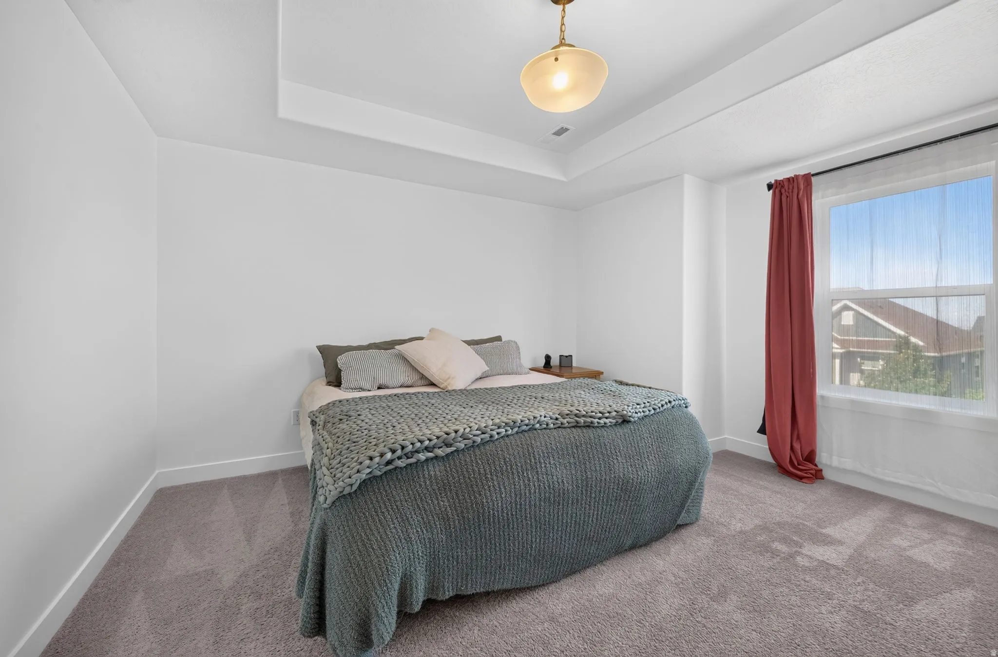 Tray ceiling with a central flush-mount light fixture