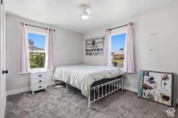 Neutral-toned walls complement plush carpeting